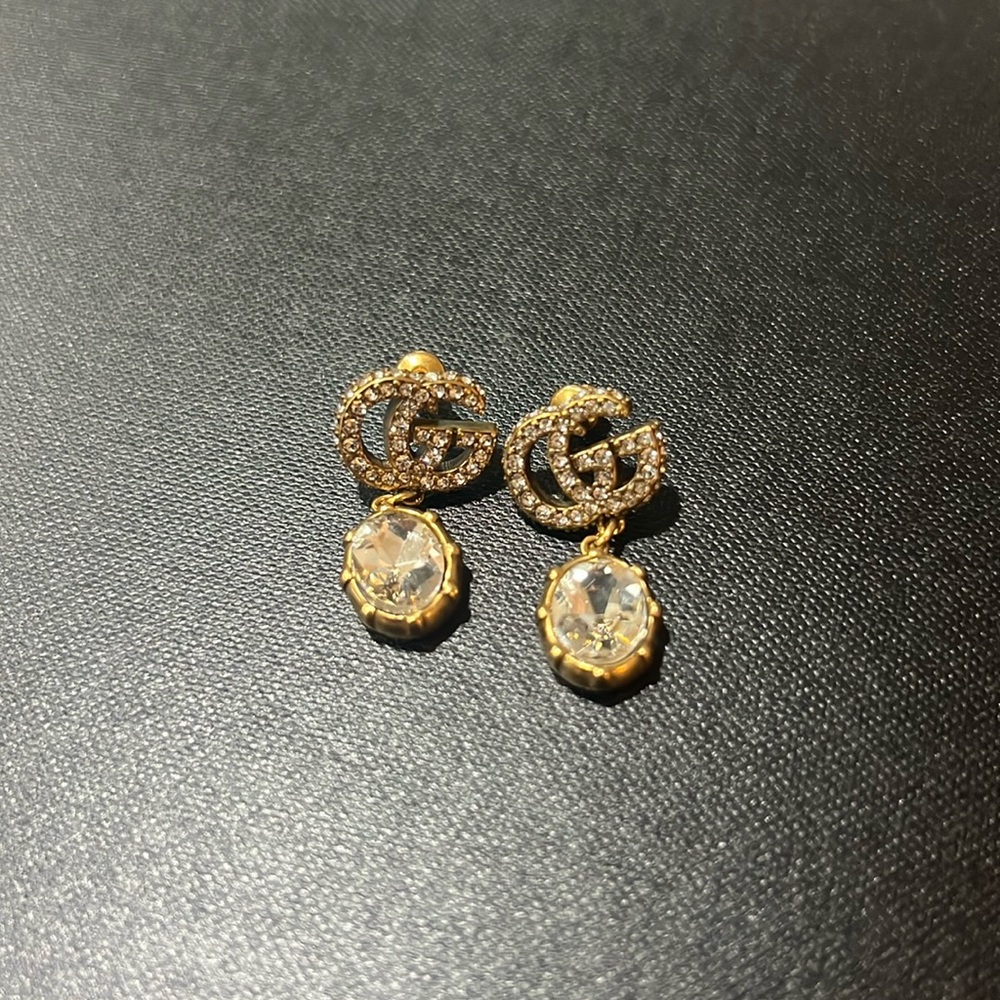 GUCCI
Double G embellished earrings